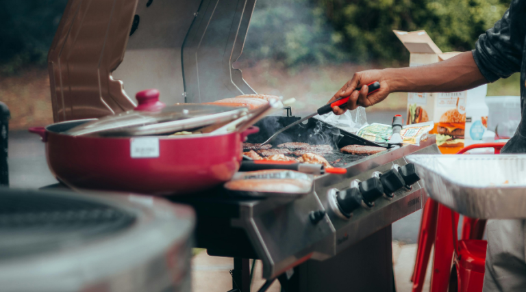 someone BBQing on a grill