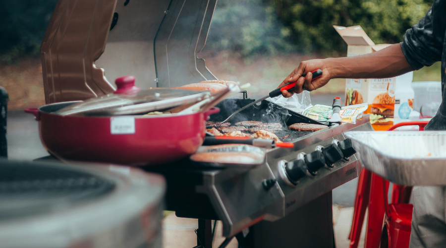 someone BBQing on a grill